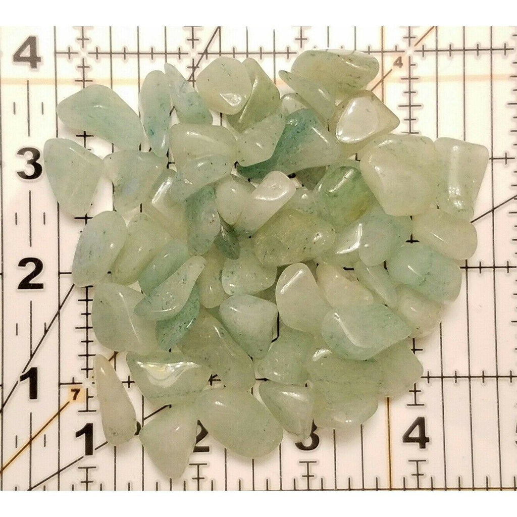 Small Tumbled Green Aventurine Gemstones on a Ruler Mat for Size