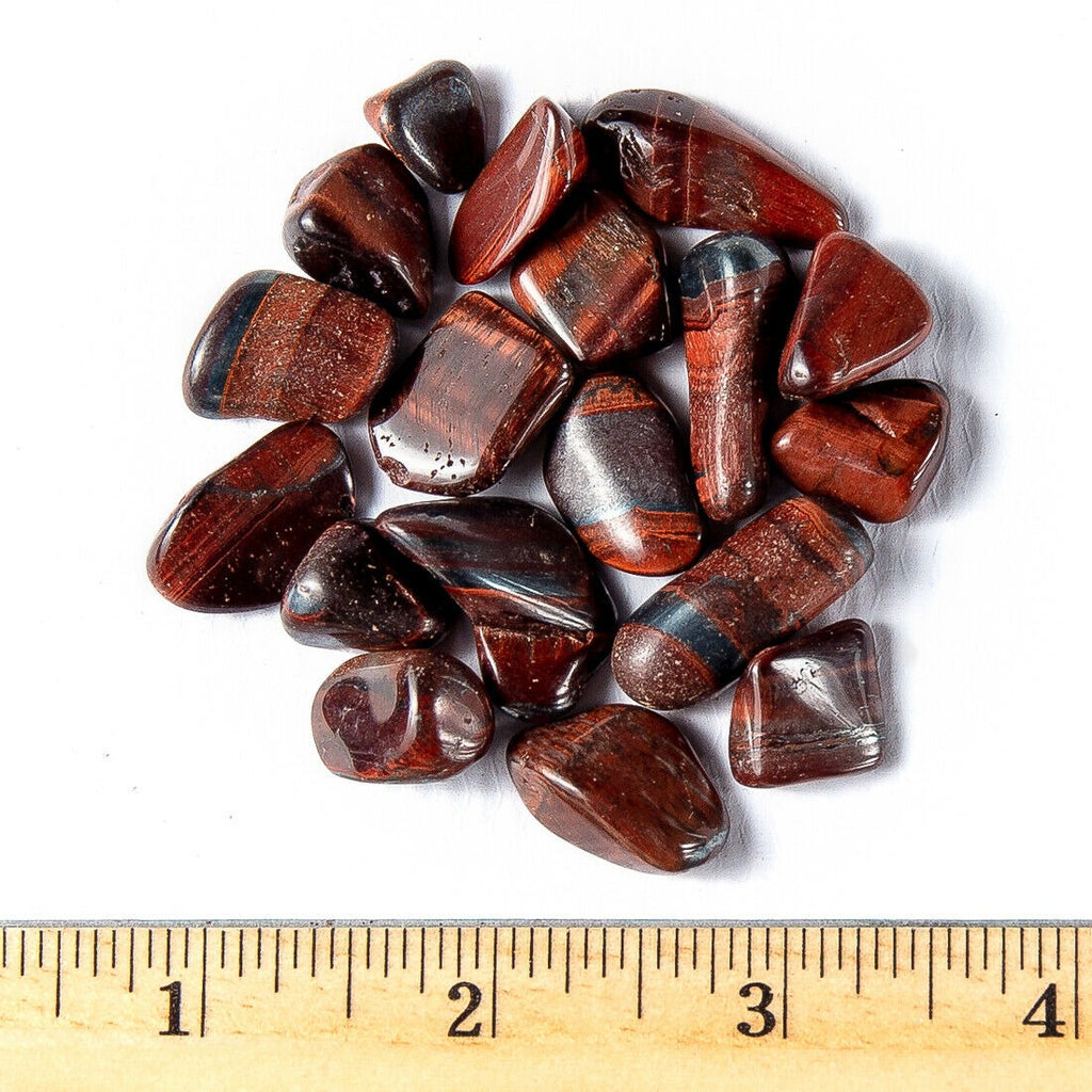 Small Tumbled Red Tigers Eye Gemstones with a Ruler for Size